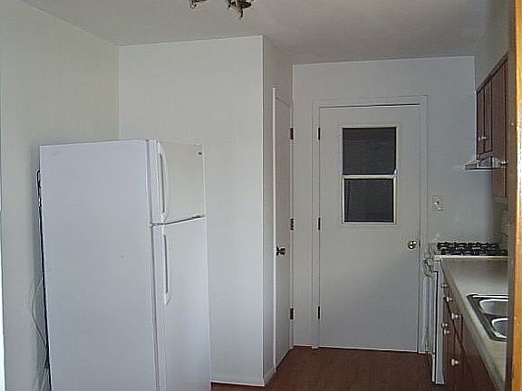 Kitchen has a large pantry at one end.