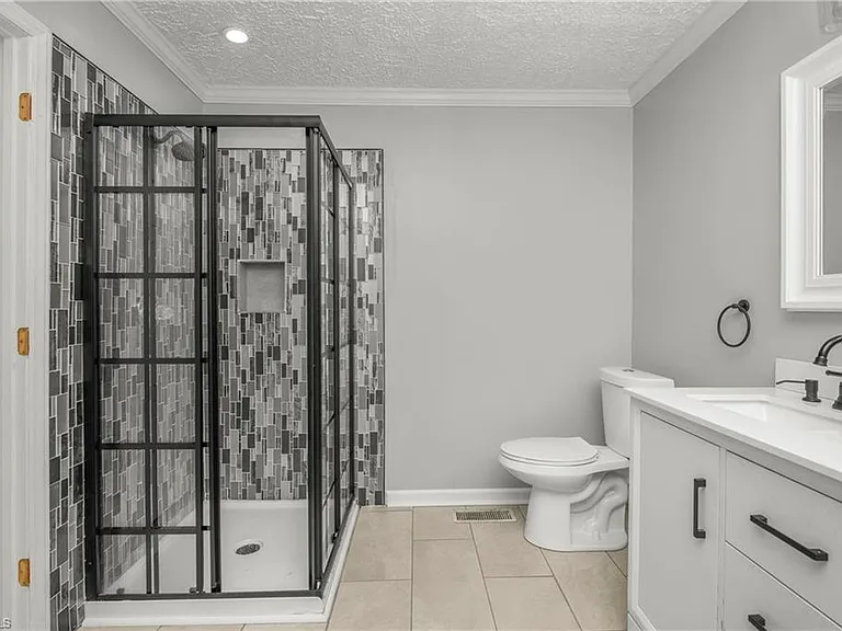 Primary Bathroom- tile shower, double sinks