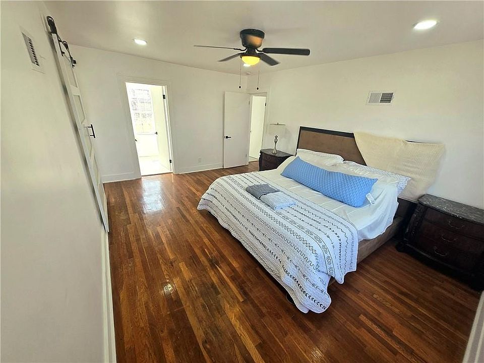 Bedroom featuring dark wood-style floors, recessed lighting, and ceiling fan