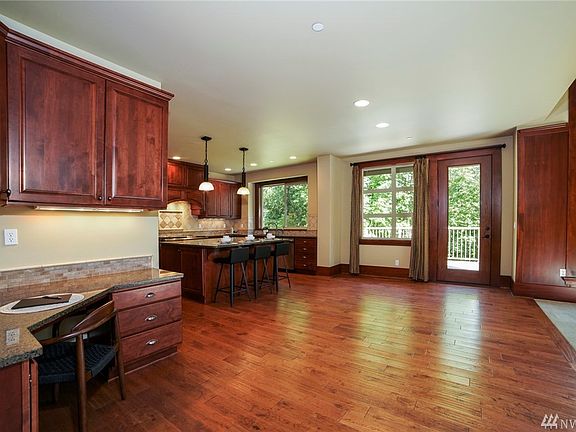 Sizable open space just off of the kitchen for your everyday table, on gorgeous top quality hand-scraped hardwood floors.