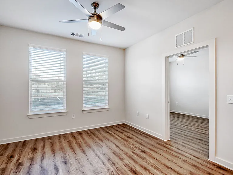 Unit Living Room with Entrance to Bedroom