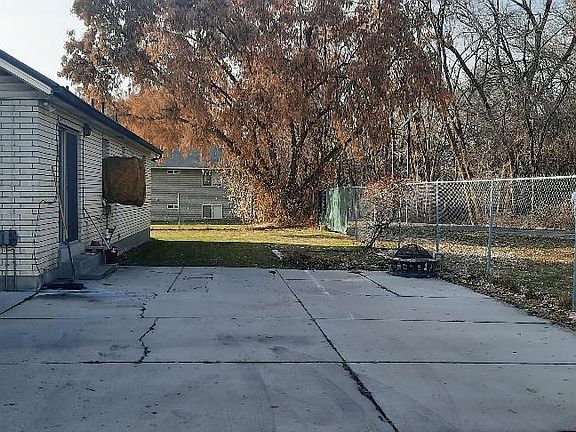 back yard and parking area. Provo bike/jogging trail is behind the fence.