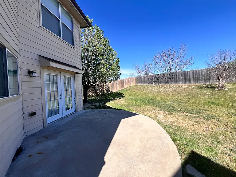 Backyard showing French doors/patio