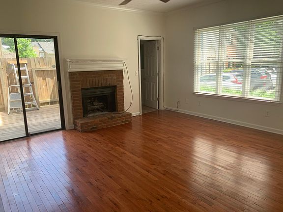 Sunny living area leading out to fenced in back porch