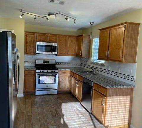 Kitchen with granite counters and stainless steel appliances
