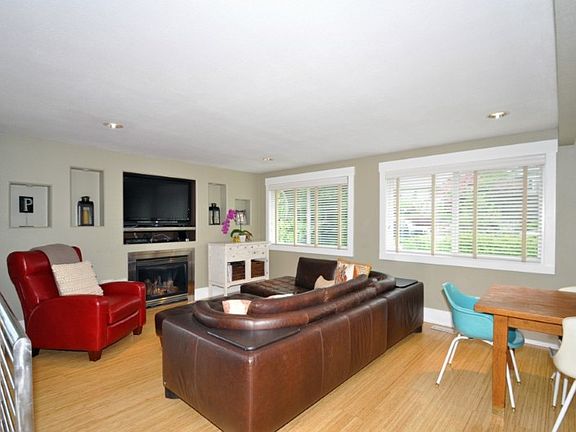 Large windows with plantation shades, bamboo floors and gas fireplace will make this one of your favorite rooms