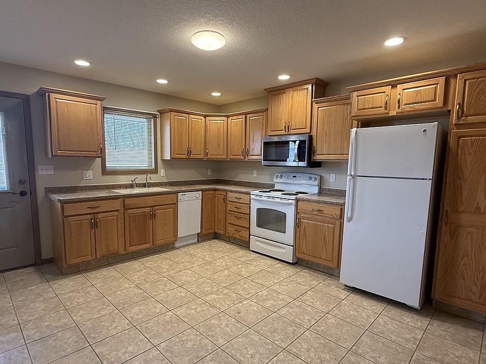 Separate kitchen/dining area with title floor