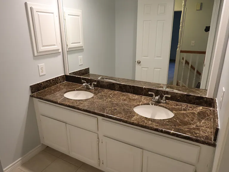 Upstairs bath with twin sinks.