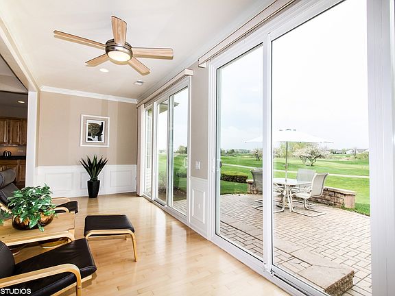 BRING THE OUTSIDE IN, RELAX IN THE SUNROOM WITH DECROTIVE MOLDING, HARDWOOD FLOORS!