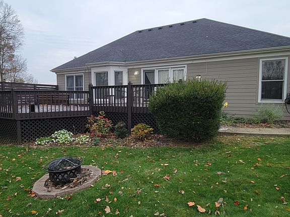 Large oversized deck on rear of home. Backyard faces wooded right of way.