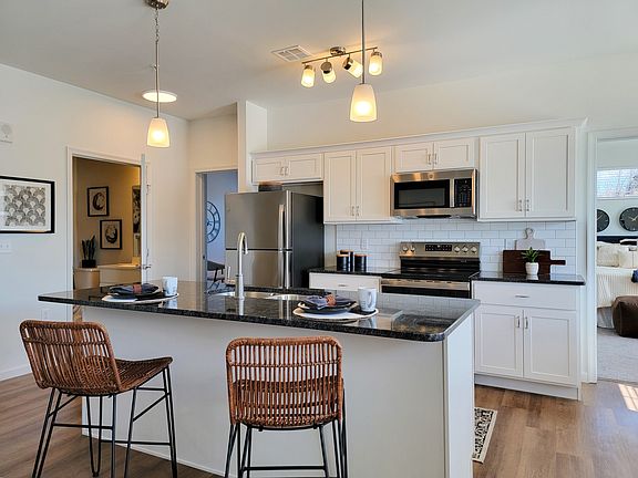 Kitchens at RedMill Crossings offer modern appliances, an island sink and breakfast bar.