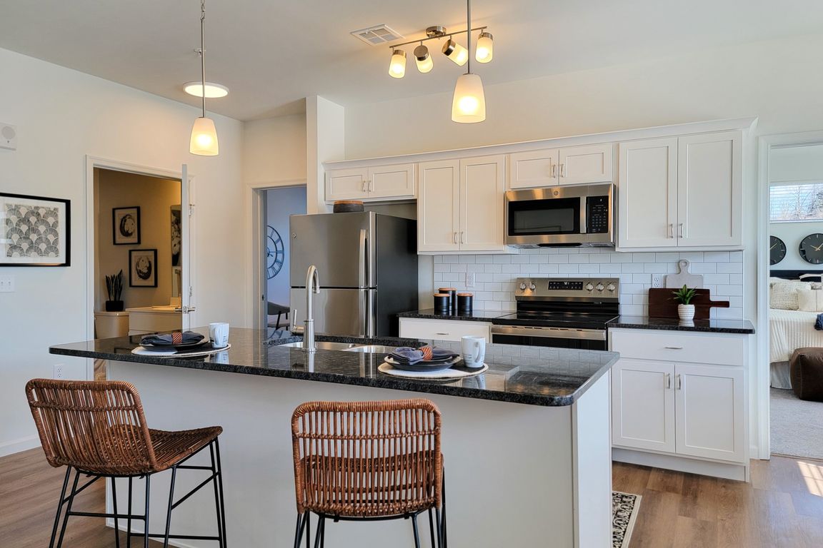 Kitchens at RedMill Crossings offer modern appliances, an island sink and breakfast bar.