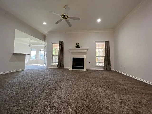 living room, gas log fireplace, new carpet and recessed lighting