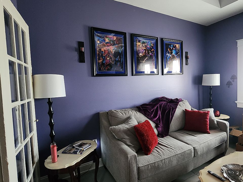 Living room complete with sofa, love seat, 2 end tables, coffee table, and TV