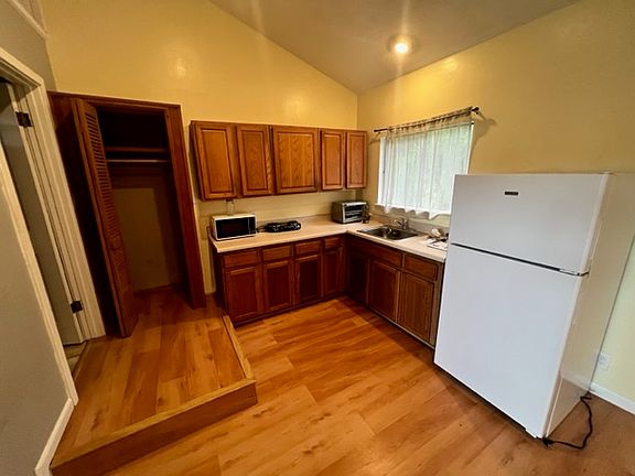 Kitchen - includes Microwave, Hotplate, Toaster Oven, and Refrigerator. NO Stove.