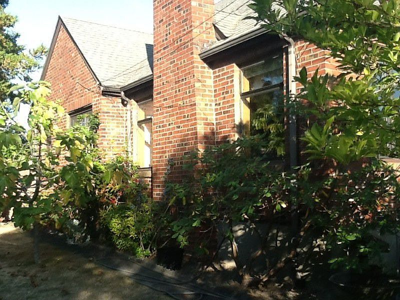 The charming 1929 Brick house sits quietly in the choice Belvidere area