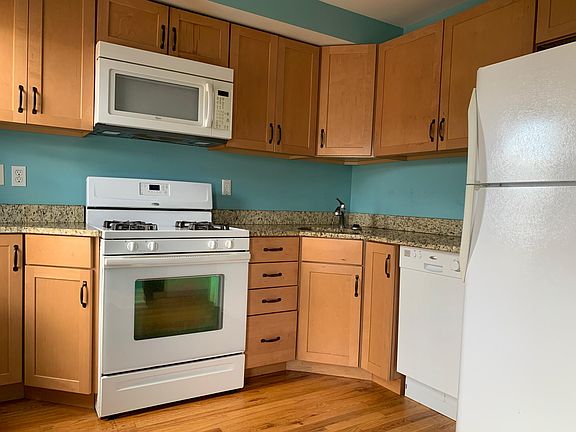 Kitchen has microwave, dishwasher, gas stove and washer and dryer