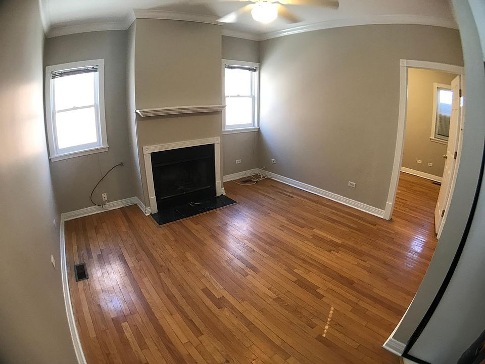 Living room with fireplace and oak floors 