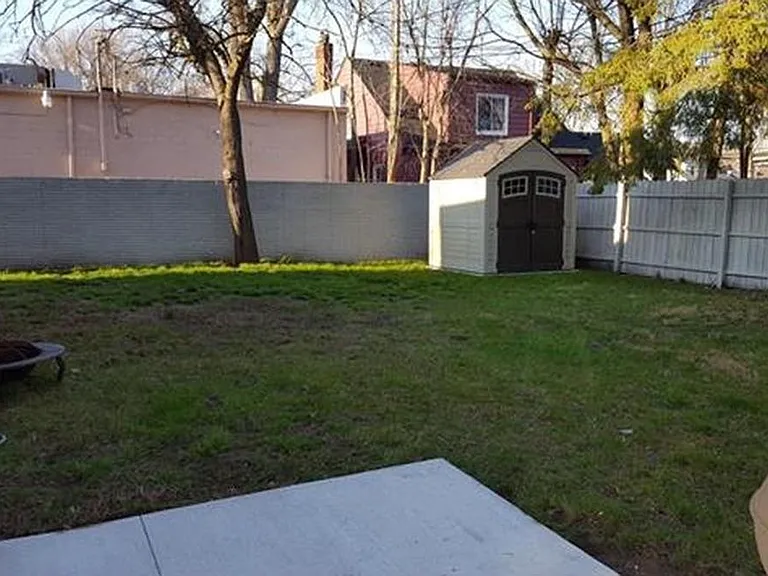 Large yard with storage shed