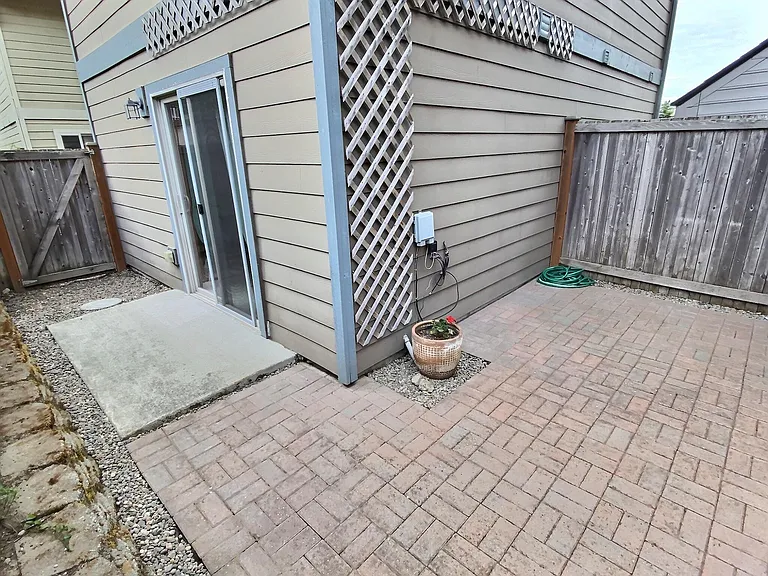 Enjoy a sunny, fenced in, private patio that's perfect for container gardening, outdoor dining, grilling, or relaxing with your morning coffee.