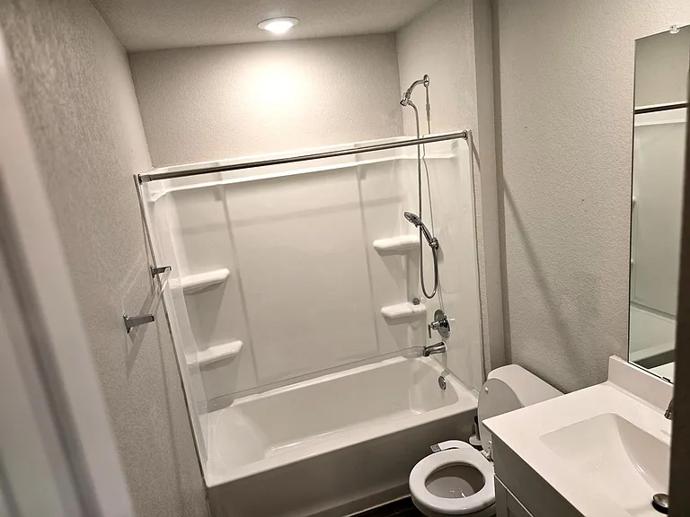 Well-maintained secondary bathroom for convenience and shared use. Clean and modern full bathroom featuring a tub/shower combo and updated fixtures.