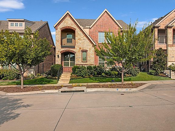 Front of the House with Trees & Flower bed