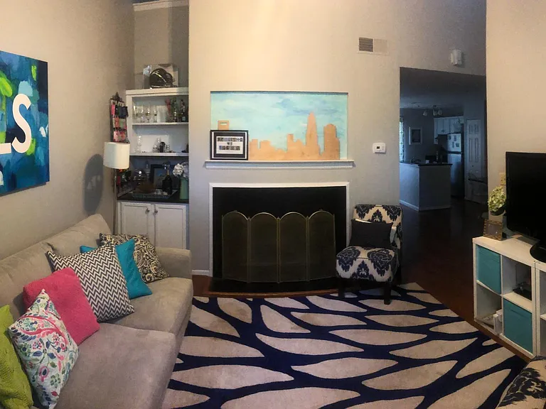 Living Room with working wood Fireplace & Bar