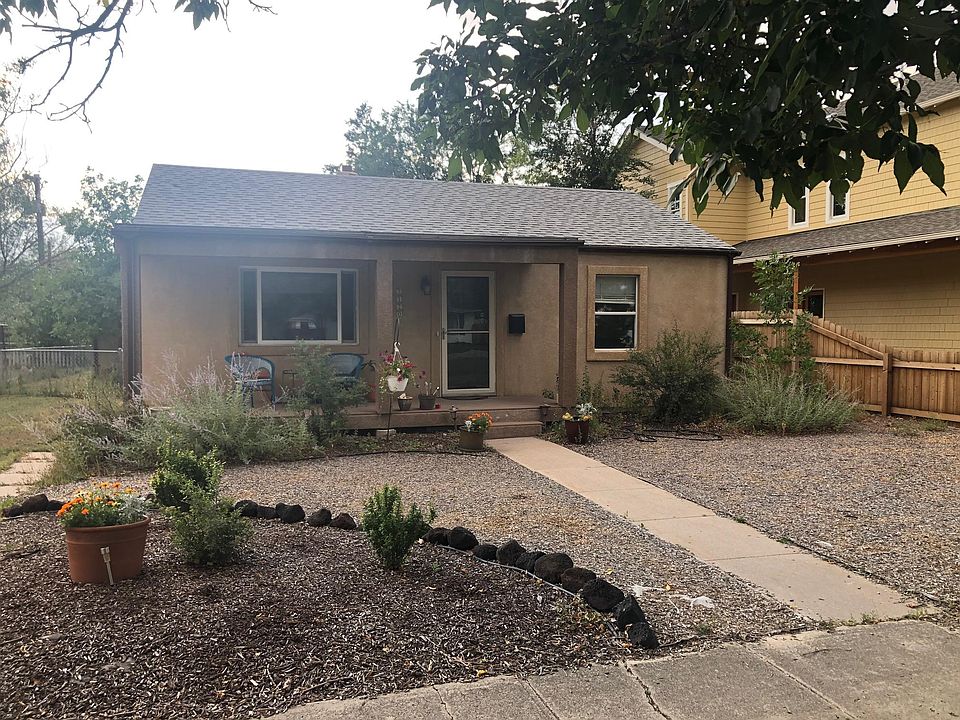 Zero landscaping, nice front porch. Carport/driveway to the left.