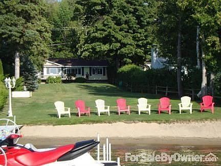 Main house from lake
						:
						beautiful sandy beach