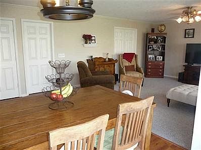 Breakfast Area/Room. Looking through the breakfast area you will see a door to the right and that goes to the den/library off of the family room which has built in bookshelves and getting new carpet soon
