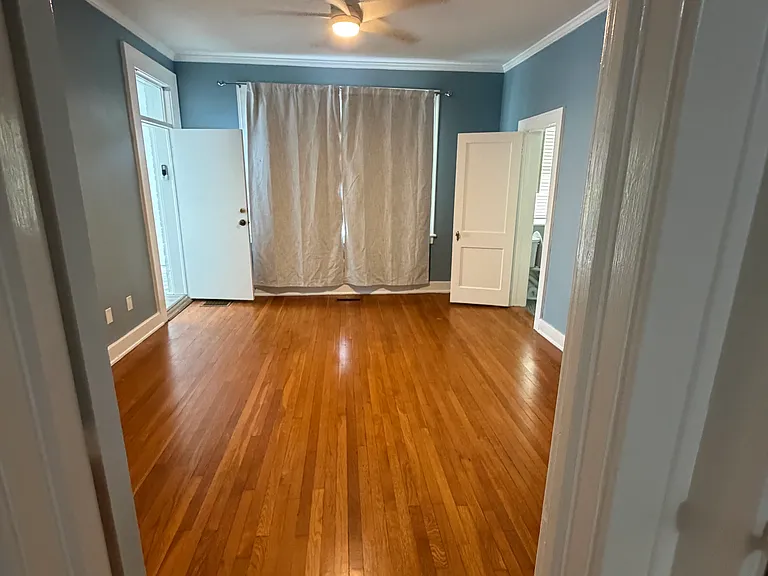 Master bedroom. Master bath on the right, sunroom on the left