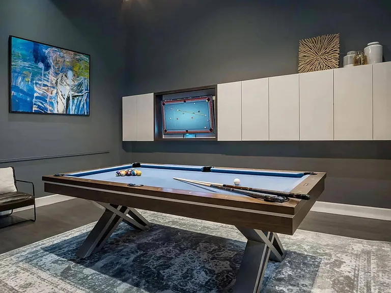 Private Game Room with Pool Table and Wall-Mounted Art