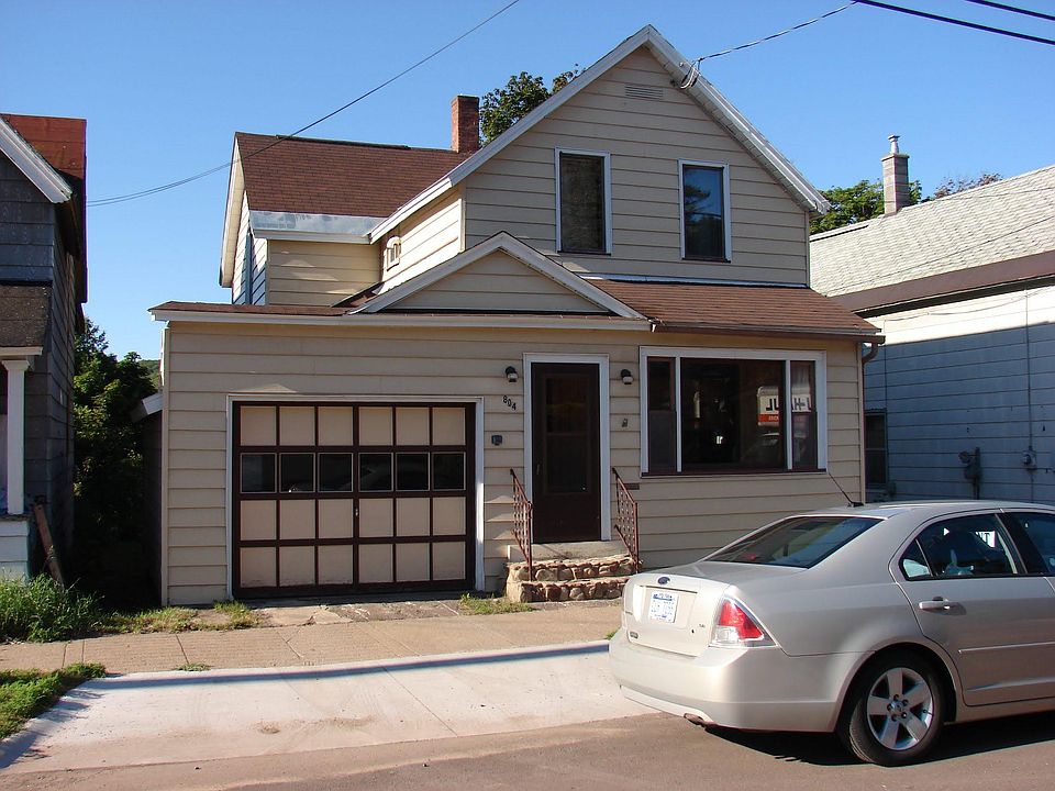 Front of house showing single car garage