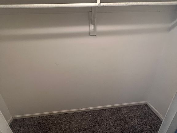 Spacious walk-in closet with ample storage and hanging space.