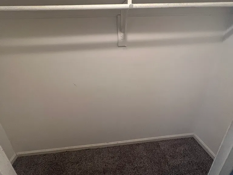 Spacious walk-in closet with ample storage and hanging space.