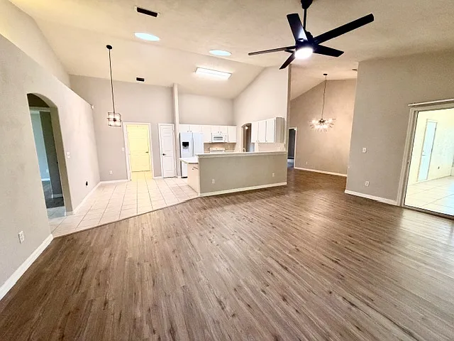 Living room facing kitchen & kitchenette