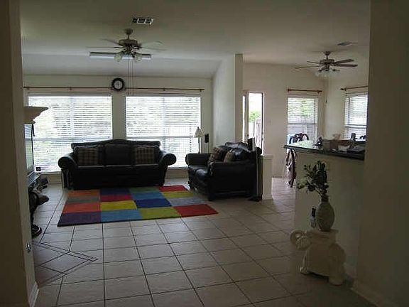 Very spacious living area...extensive tile is fabulous.overlooks great backyd