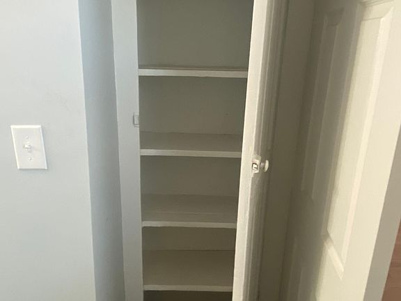 Linen closet inside bathroom