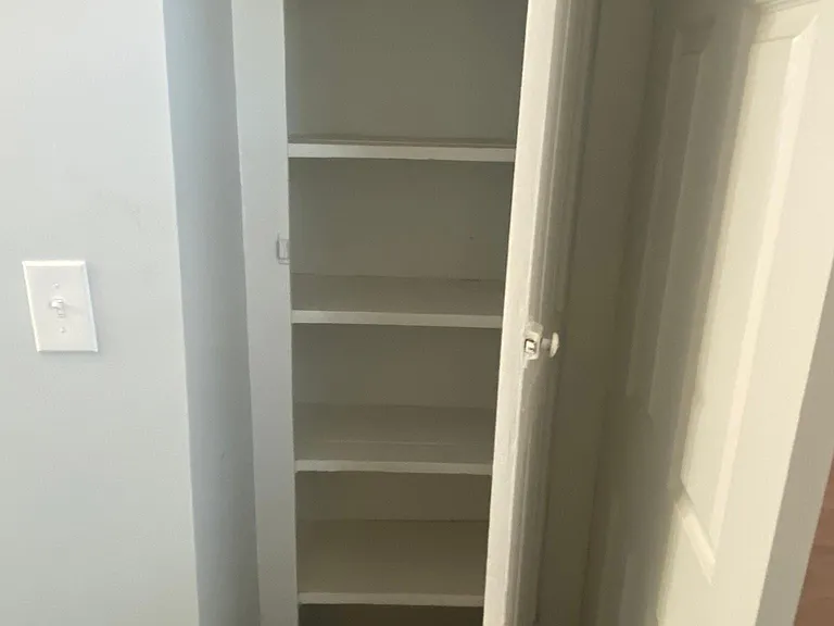 Linen closet inside bathroom