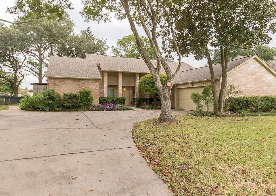 Gorgeous trees and mature landscaping greet you at this 4 BR, 3 Bath home with a pool on the golf course