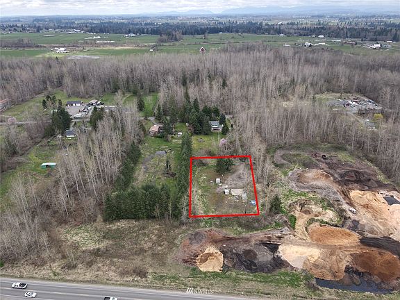 1 AC vacant lot Buckley, WA with water and power on the lot. Lot is behind home with Entwhistle Road East address. Look for John L Scott sign and go down the road to access the lot. >