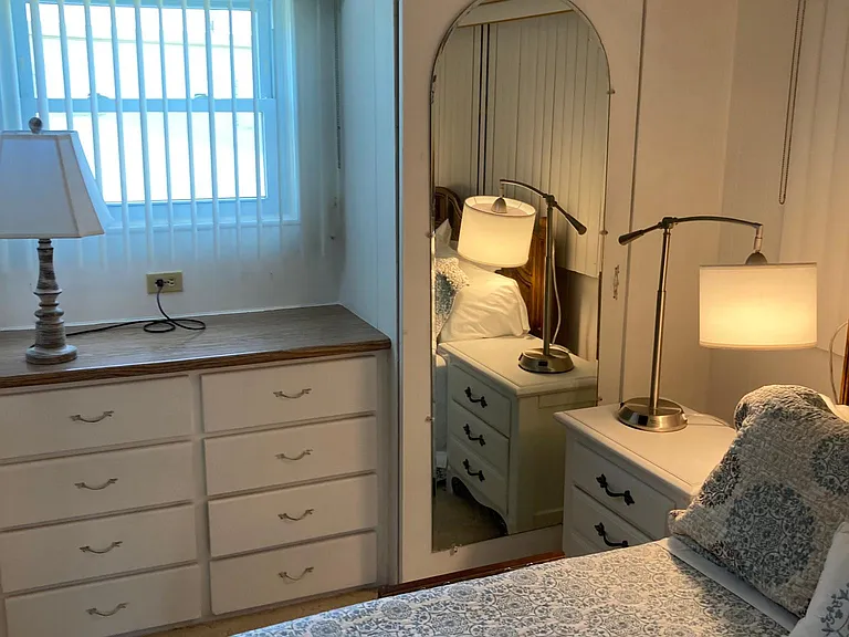 View of window, built-in dresser and two closets in 2nd "bedroom" currently missing a bed, but a bed will be available if the next tenant needs it for a roommate or guests.