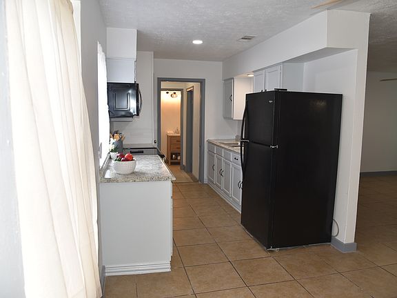 Kitchen with refrigerator
