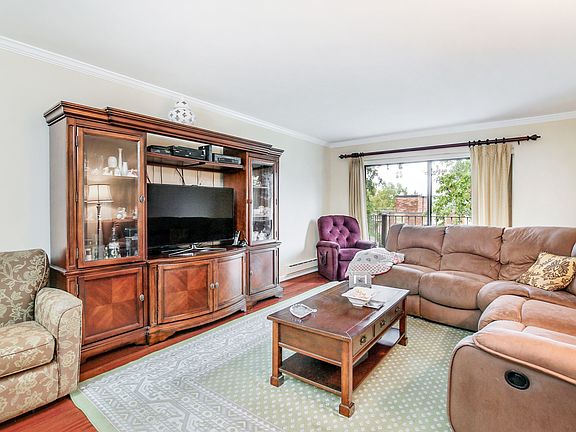 Living room facing balcony entrance
