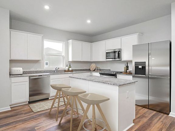 The open floorplan concept is ideal for preparing meals in the Kitchen. - Model Representation