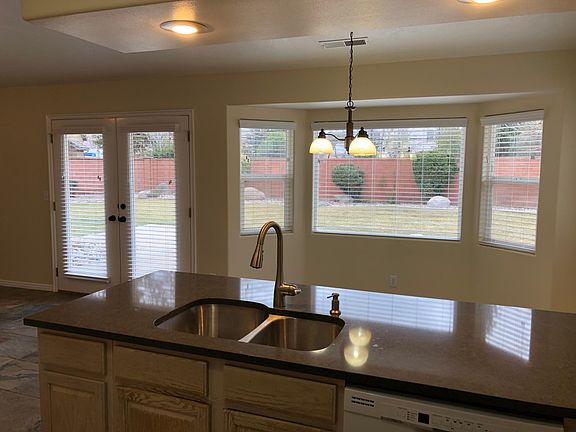 View of backyard when standing at the kitchen sink