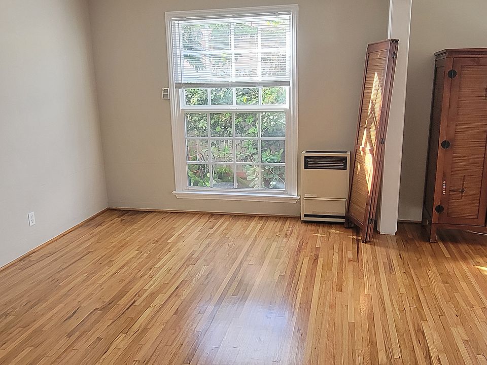 Dining room with ceiling fan and hardwood floors