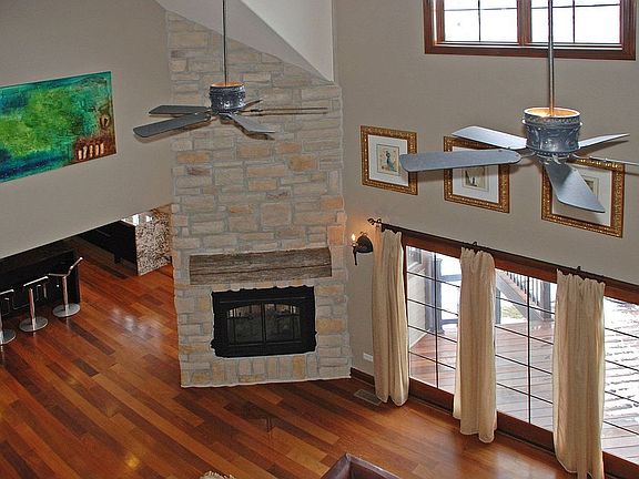 2Story Stone Dual Fireplace, Low-E Engy Eff Wood Windows, Braz Walnut Ext Deck