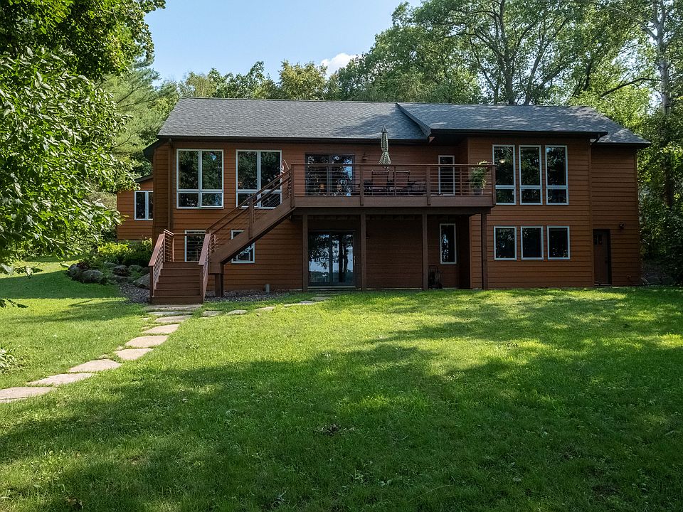 Lakeside view of home & deck
