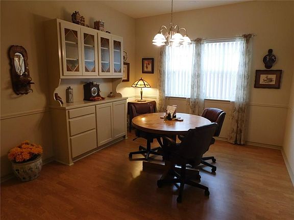 DINING AREA WITH LOVELY BUILD IN CABINET.